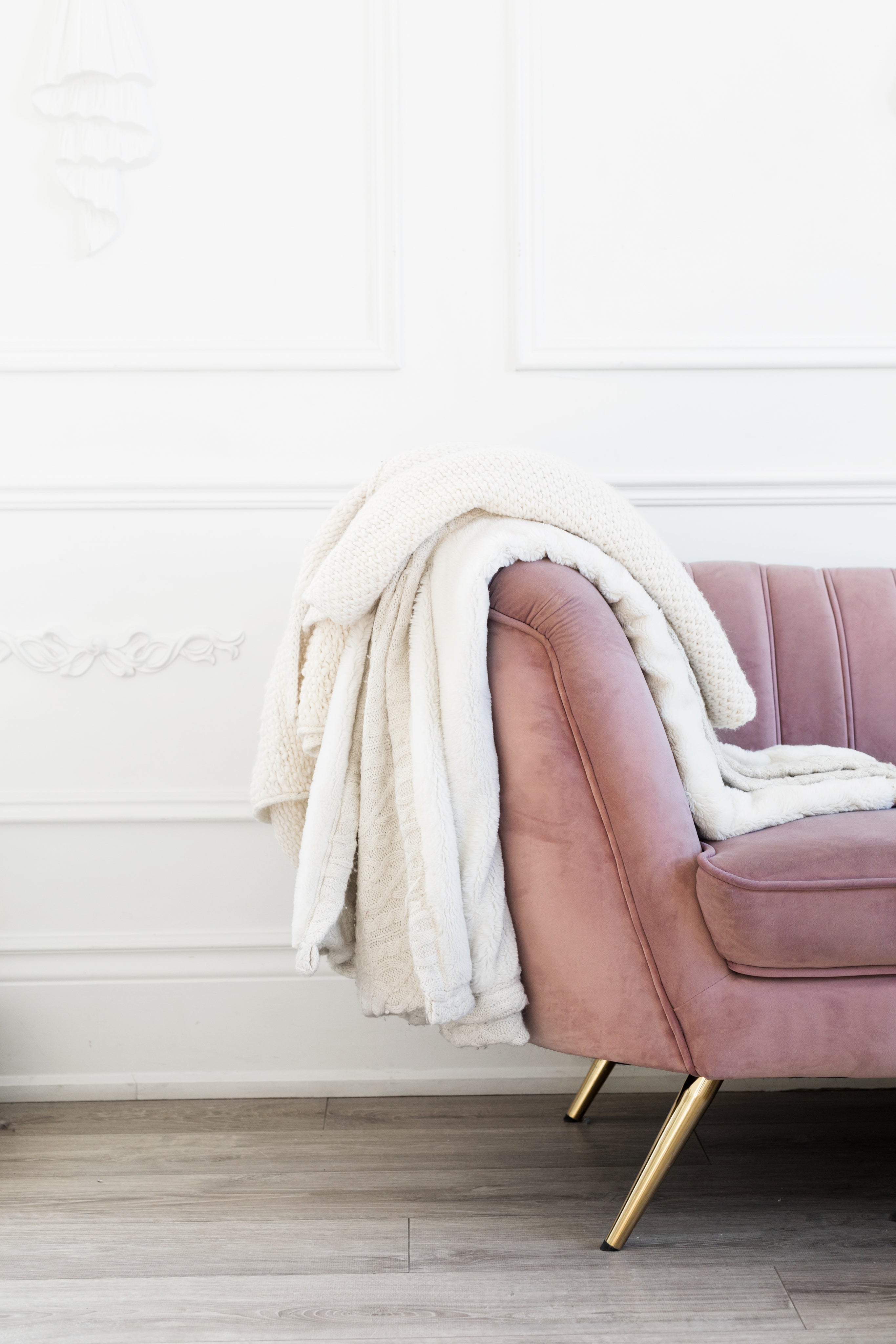 blush-coloured-couch-with-blankets.jpg